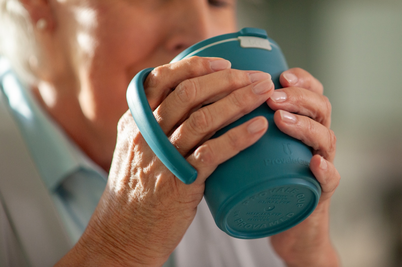 Tilting the cup to drink
